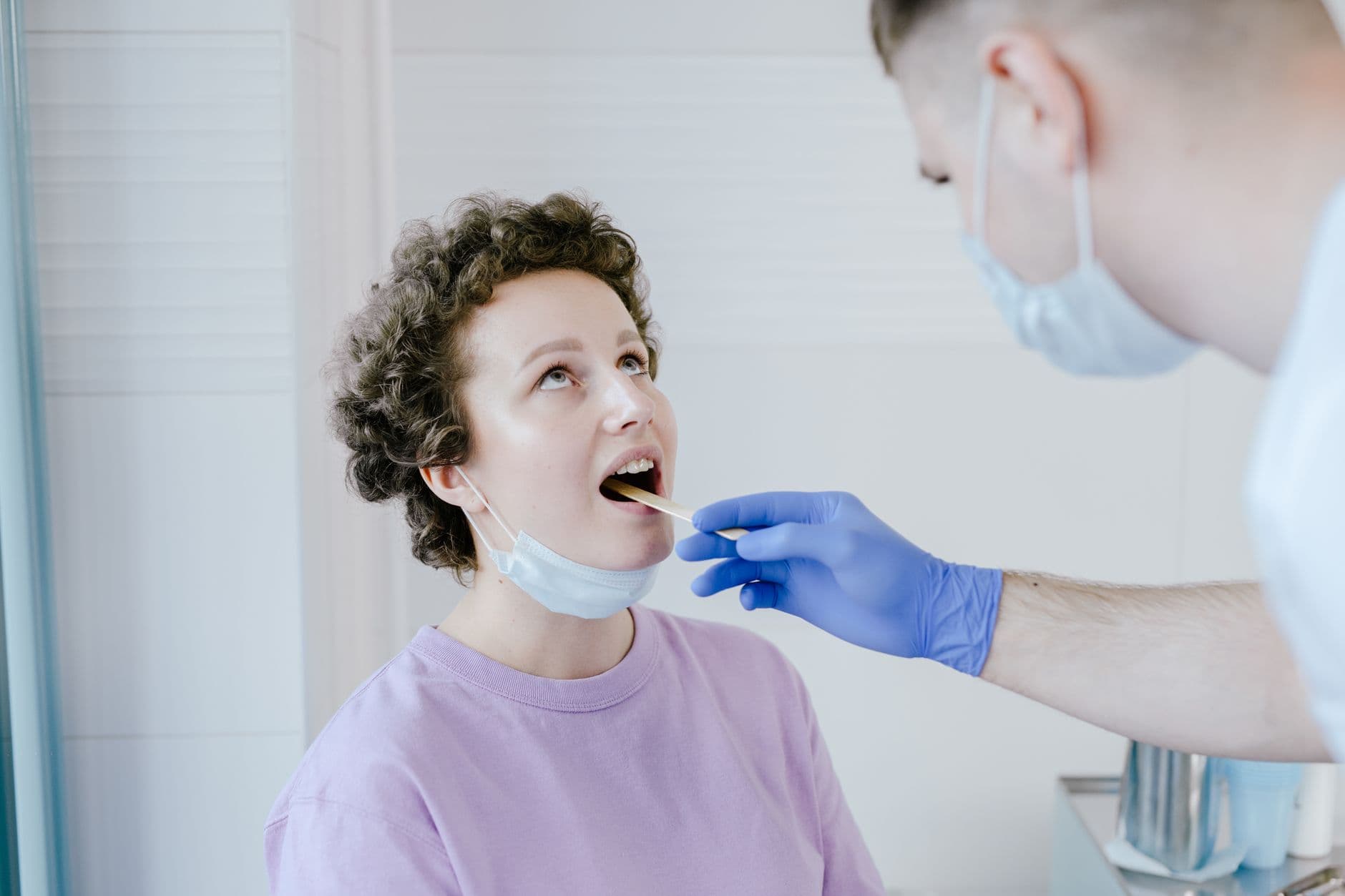 Clinician examining a patient in a clinic